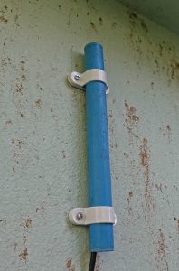WiFi dongle on wall in pipe.